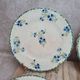Set of 4 antique dessert plates in ironstone, with blue and green floral decoration.