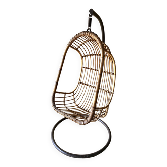 Vintage rattan hanging chair with its stand.
