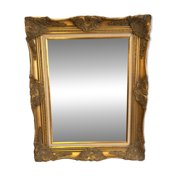Golden wooden mirror in Louis XV style