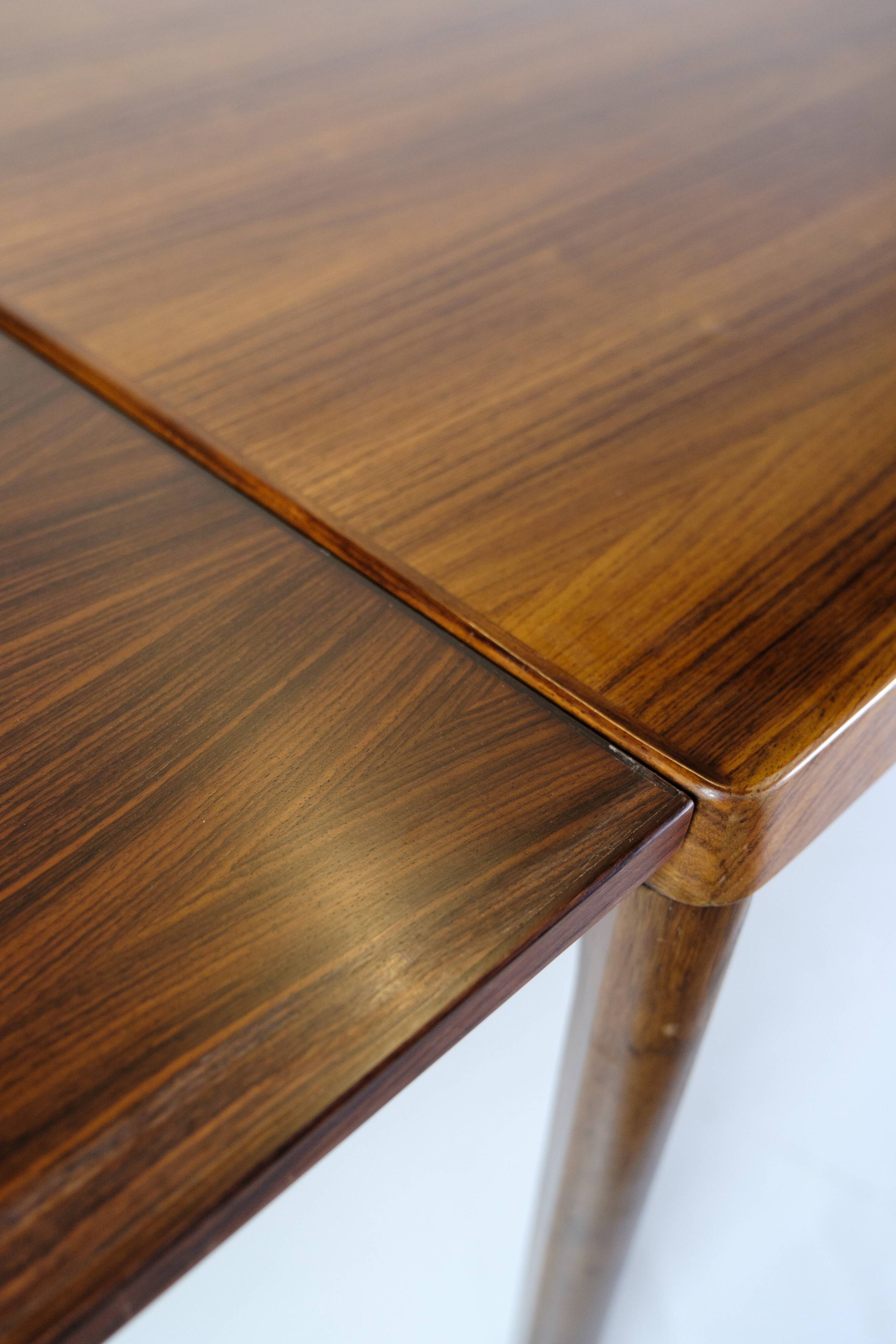 Dining Table With extensions Made In Rosewood By Henning Kjærnulf From 1960s