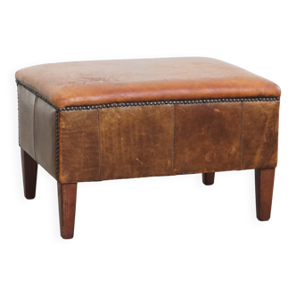Pouf vintage en cuir de mouton