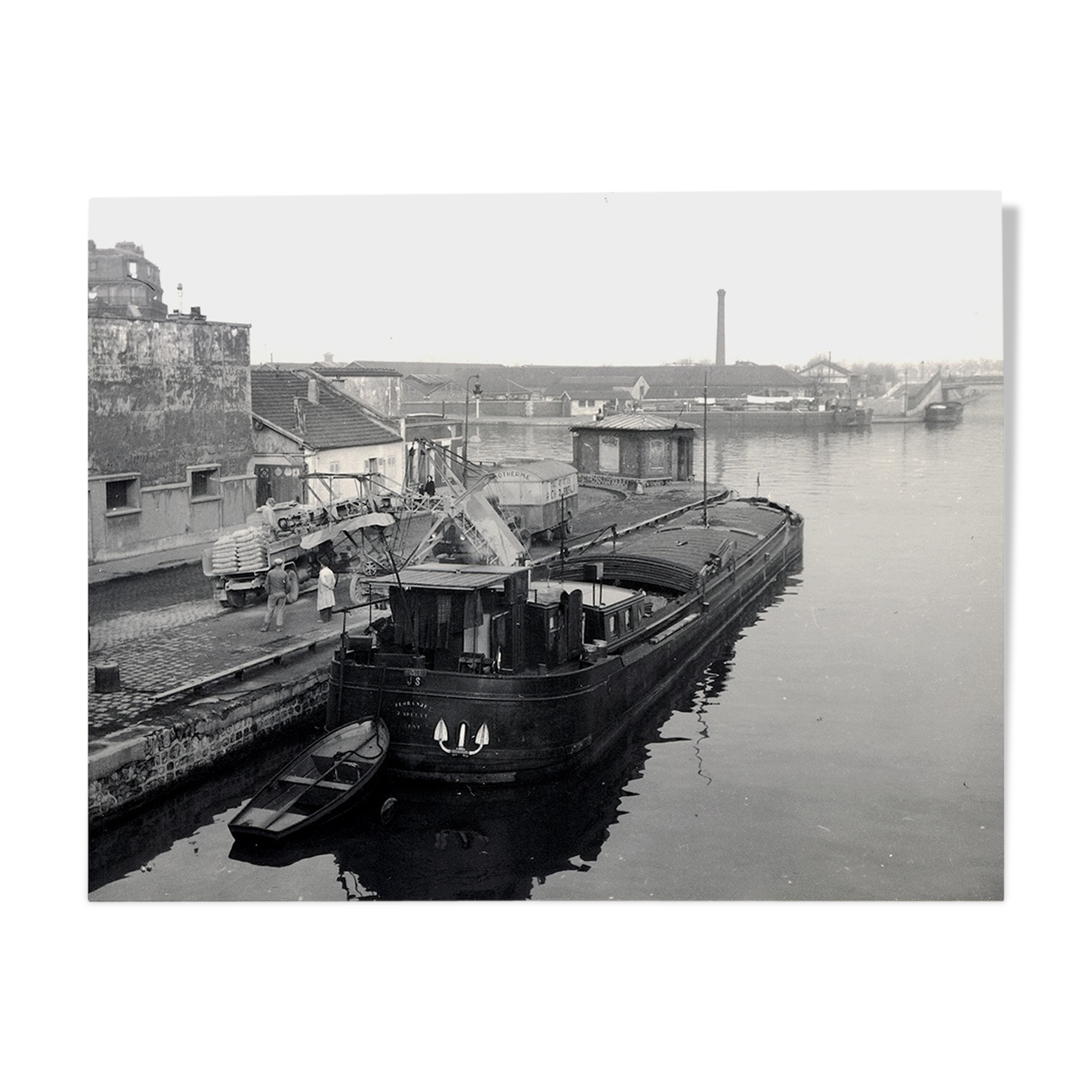 Ancient photo of a barge on a canal north of Paris