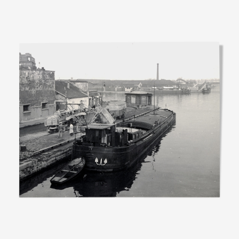 Ancient photo of a barge on a canal north of Paris