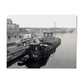 Ancient photo of a barge on a canal north of Paris