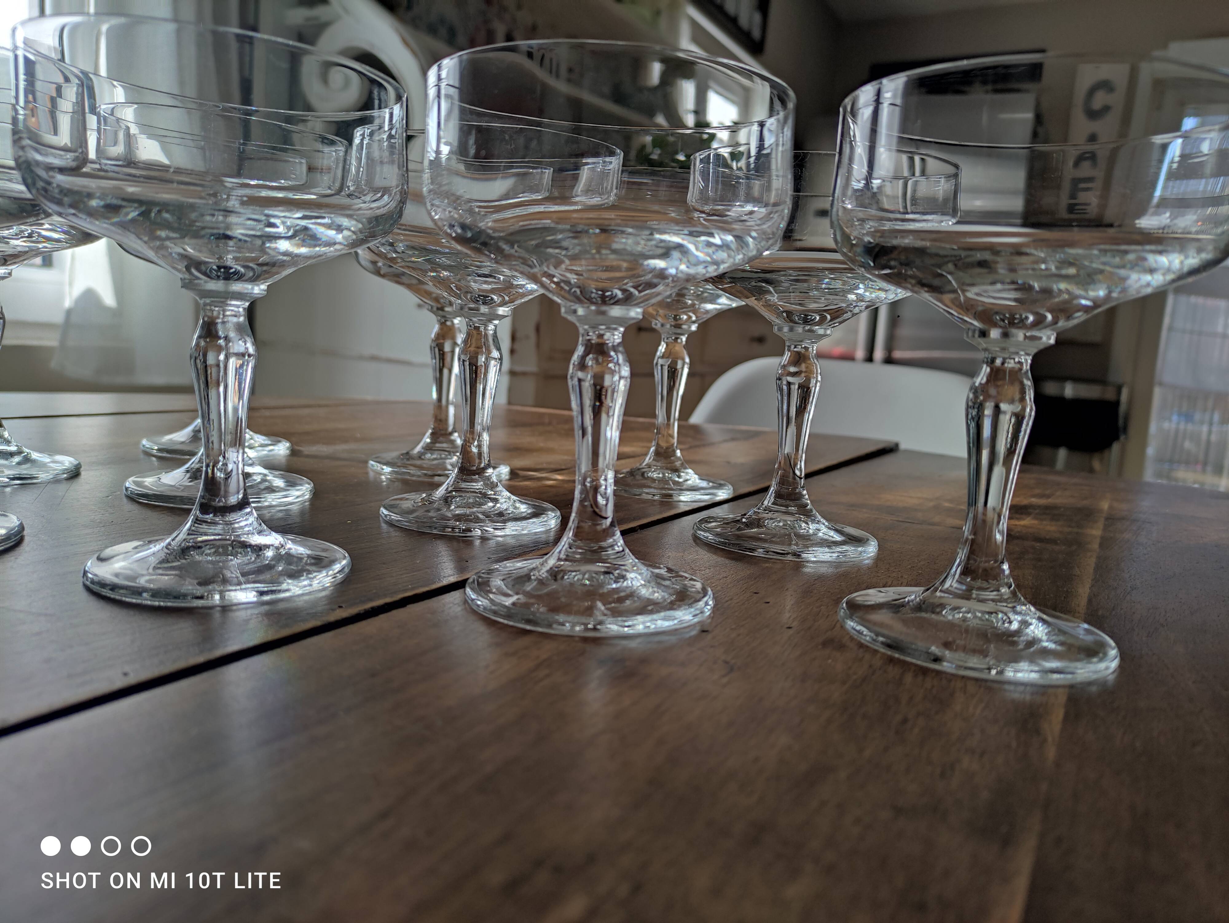 Set of 12 vintage glass champagne glasses with curved foot
