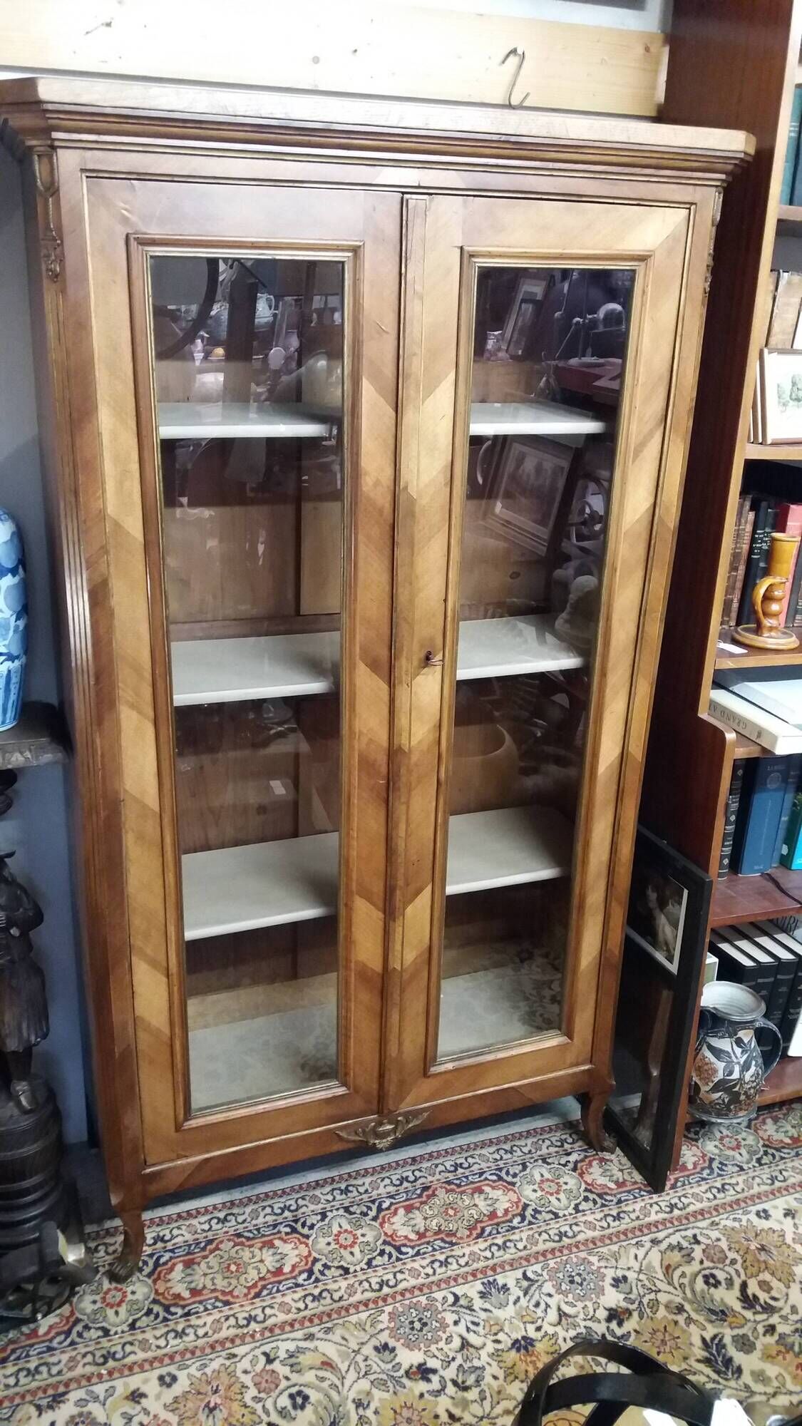 Two-door display cabinet in transitional style.