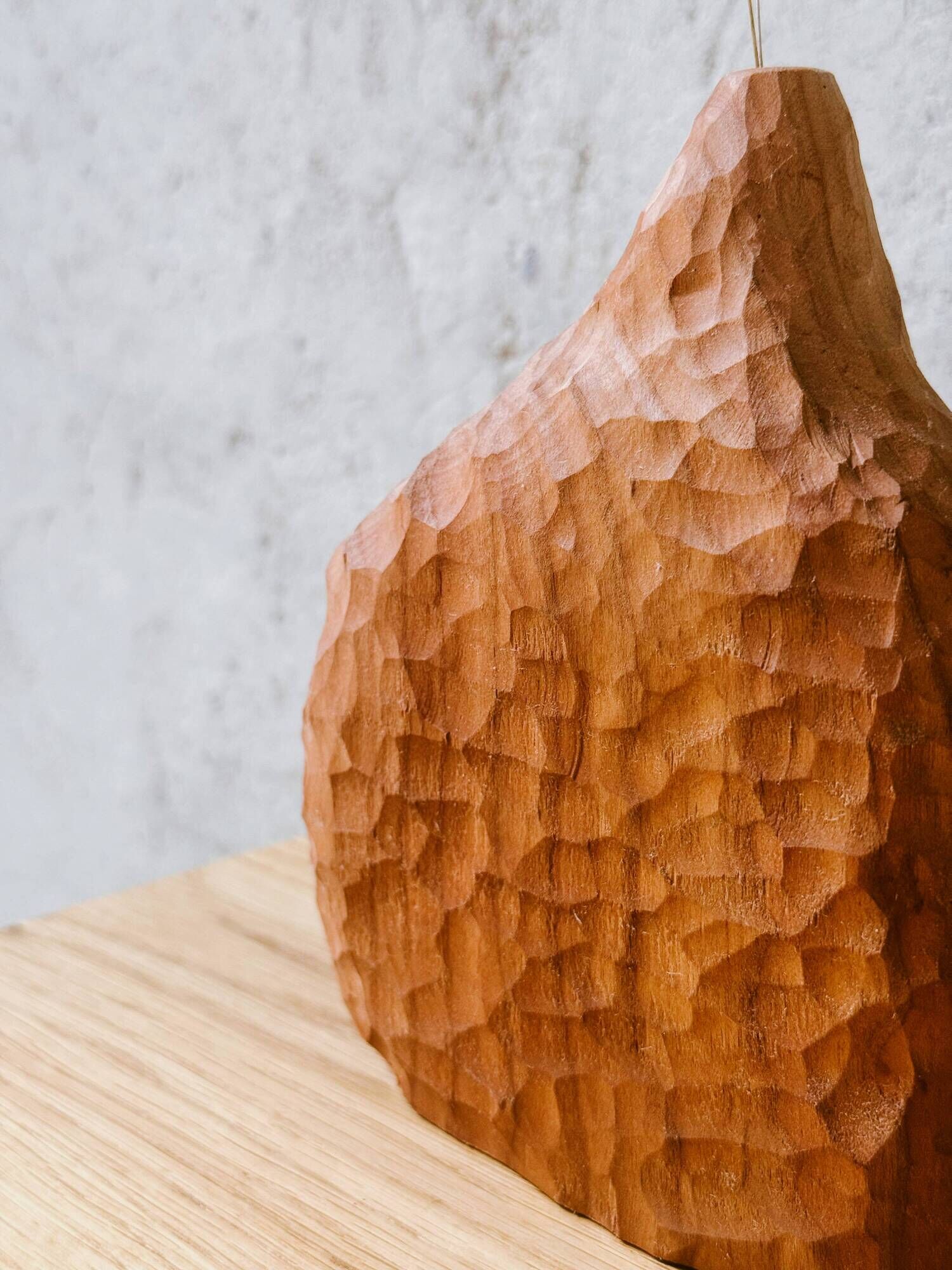 Hand-carved soliflore vase in solid cherry wood.