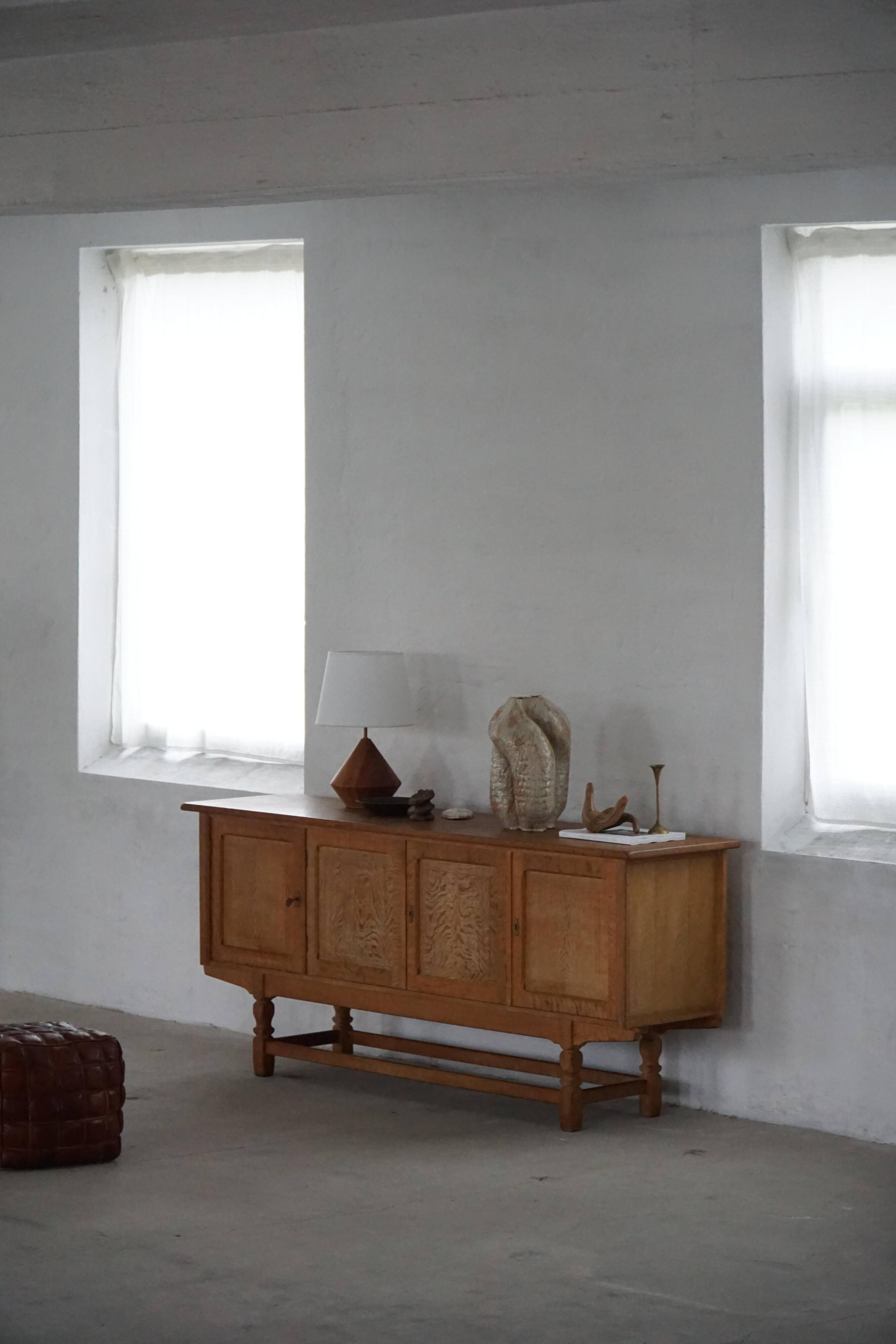 Low oak sideboard, mid-century modern, made by a Danish cabinetmaker, 1960s.