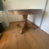 Round table in marble and walnut