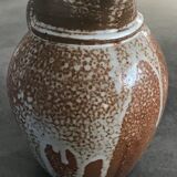 Pitcher in brown sandstone with effect of dripping and white speckling