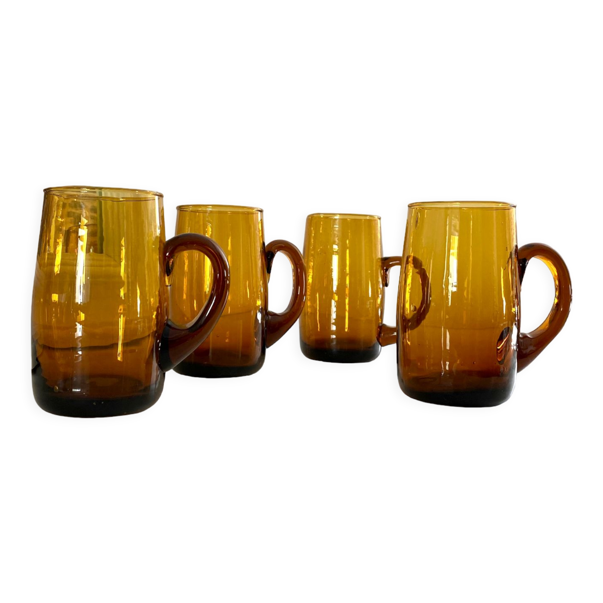 4 mugs/ mugs in vintage blown amber glass