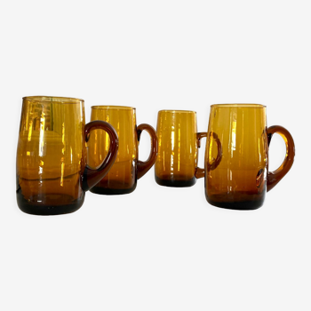 4 mugs/ mugs in vintage blown amber glass