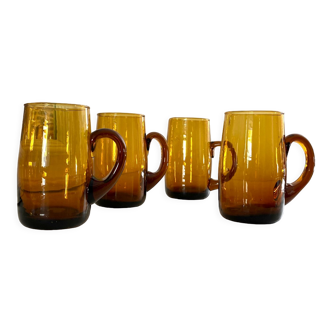 4 mugs/ mugs in vintage blown amber glass