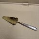 Shovel has silver metal pie art deco