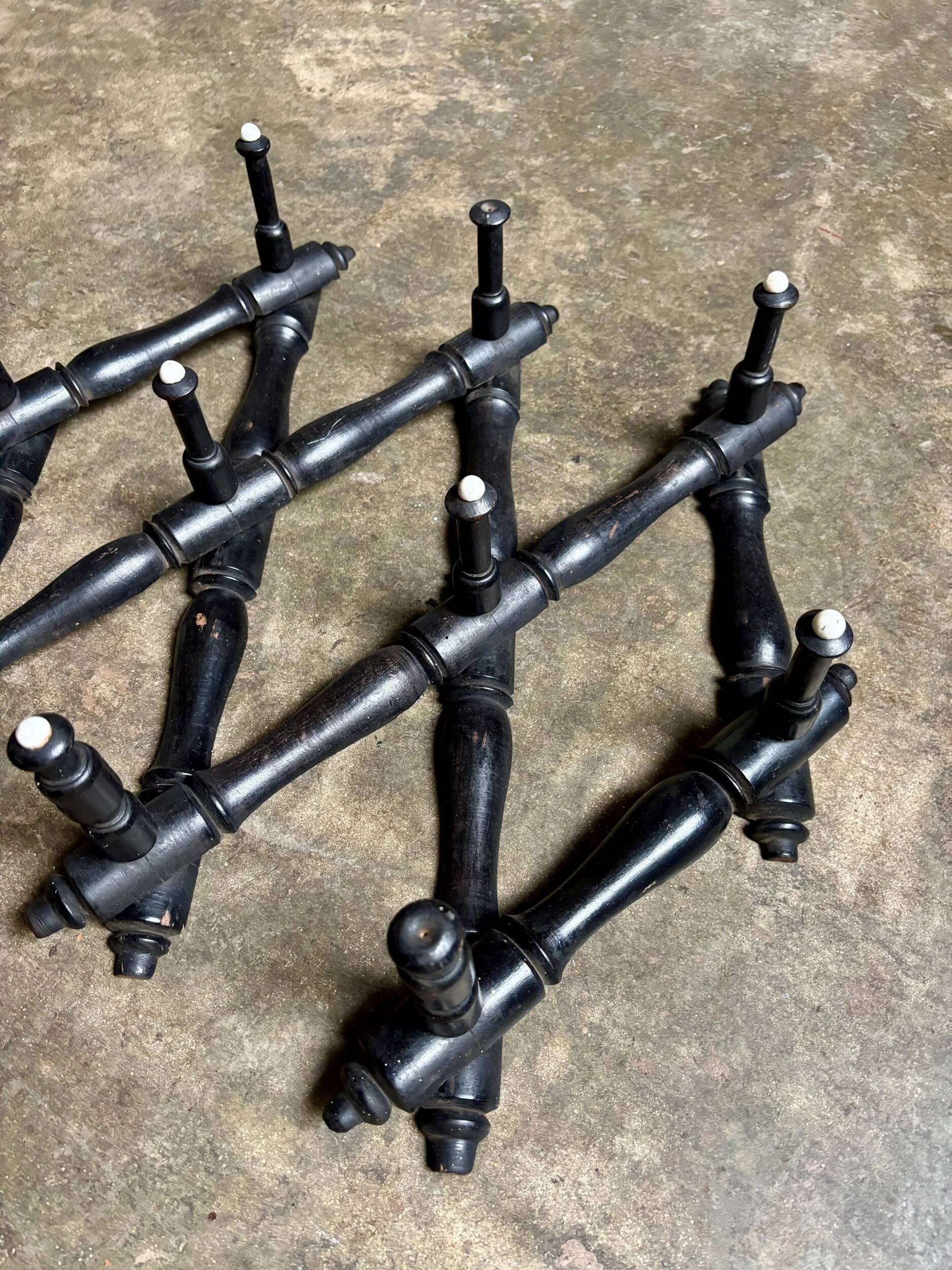 Napoleon III hinged wall-mounted coat rack in black wood