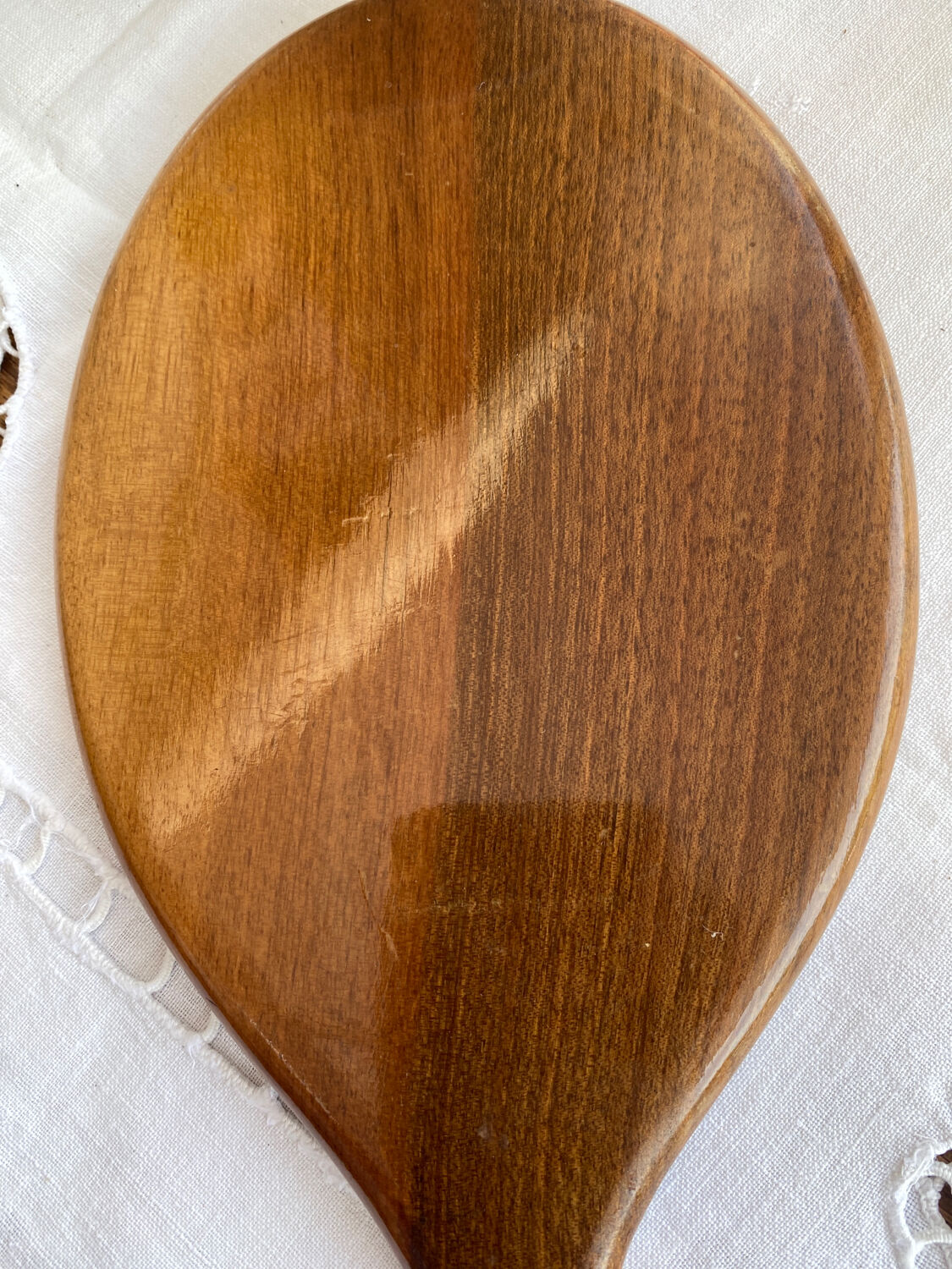 Hand-facing wooden mirror