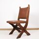 Pair of brutalist style chairs, in wood and leather.