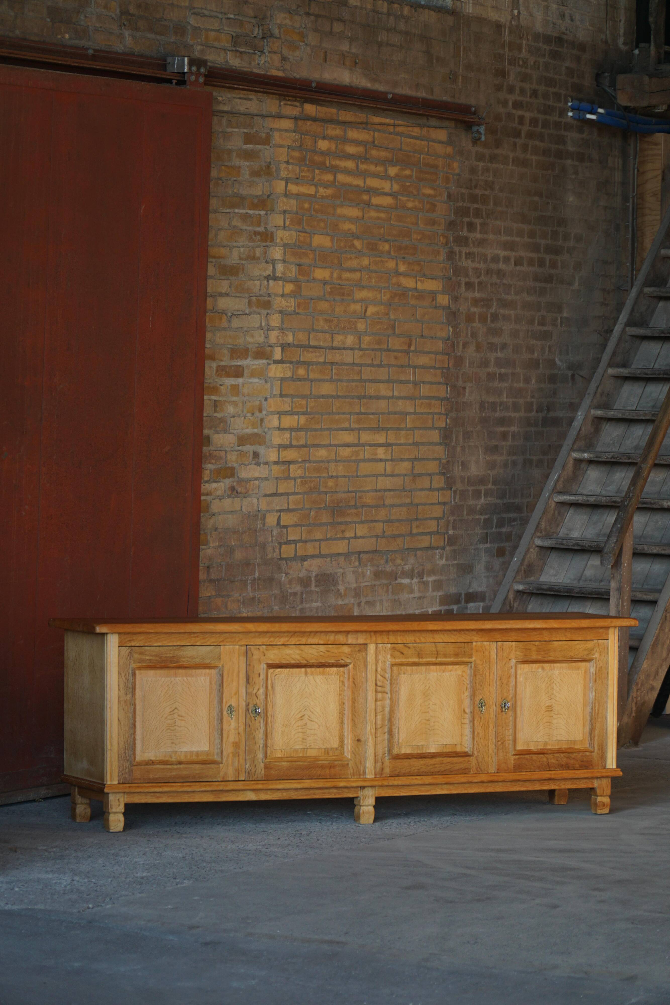 Modern Danish low enfilade in oak with panelled doors, mid-20th century.