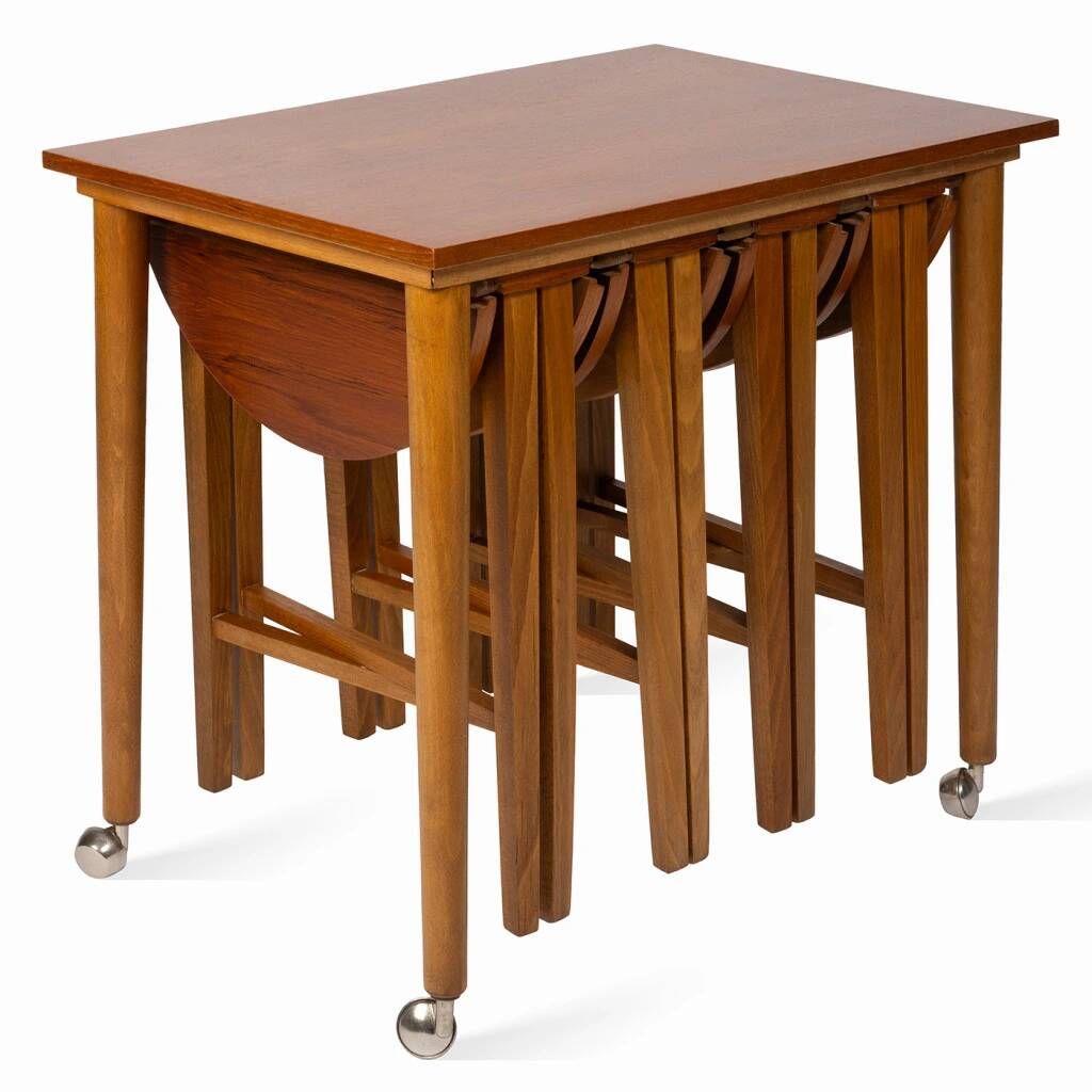 Table and four chairs set by Paul Hundevad