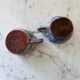 Set of artisanal pitcher and weathered cups