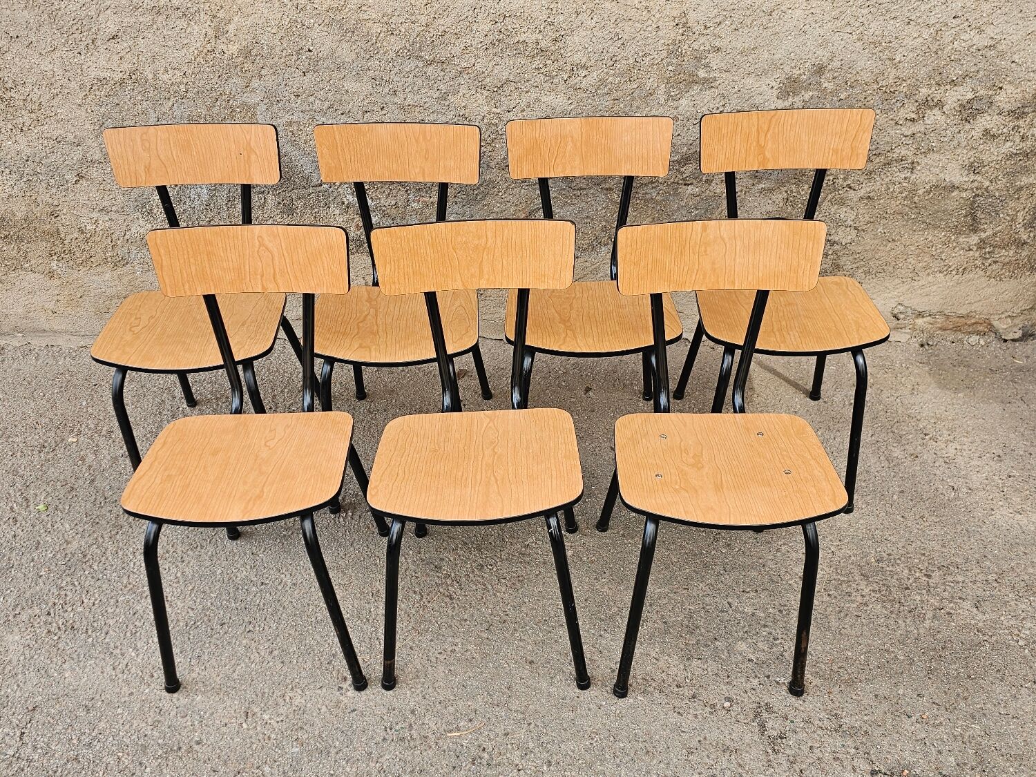 Chairs in black and light brown formica