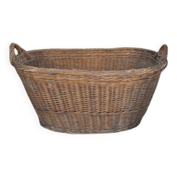 Rustic brown wicker basket from the 1940s — large oval laundry basket