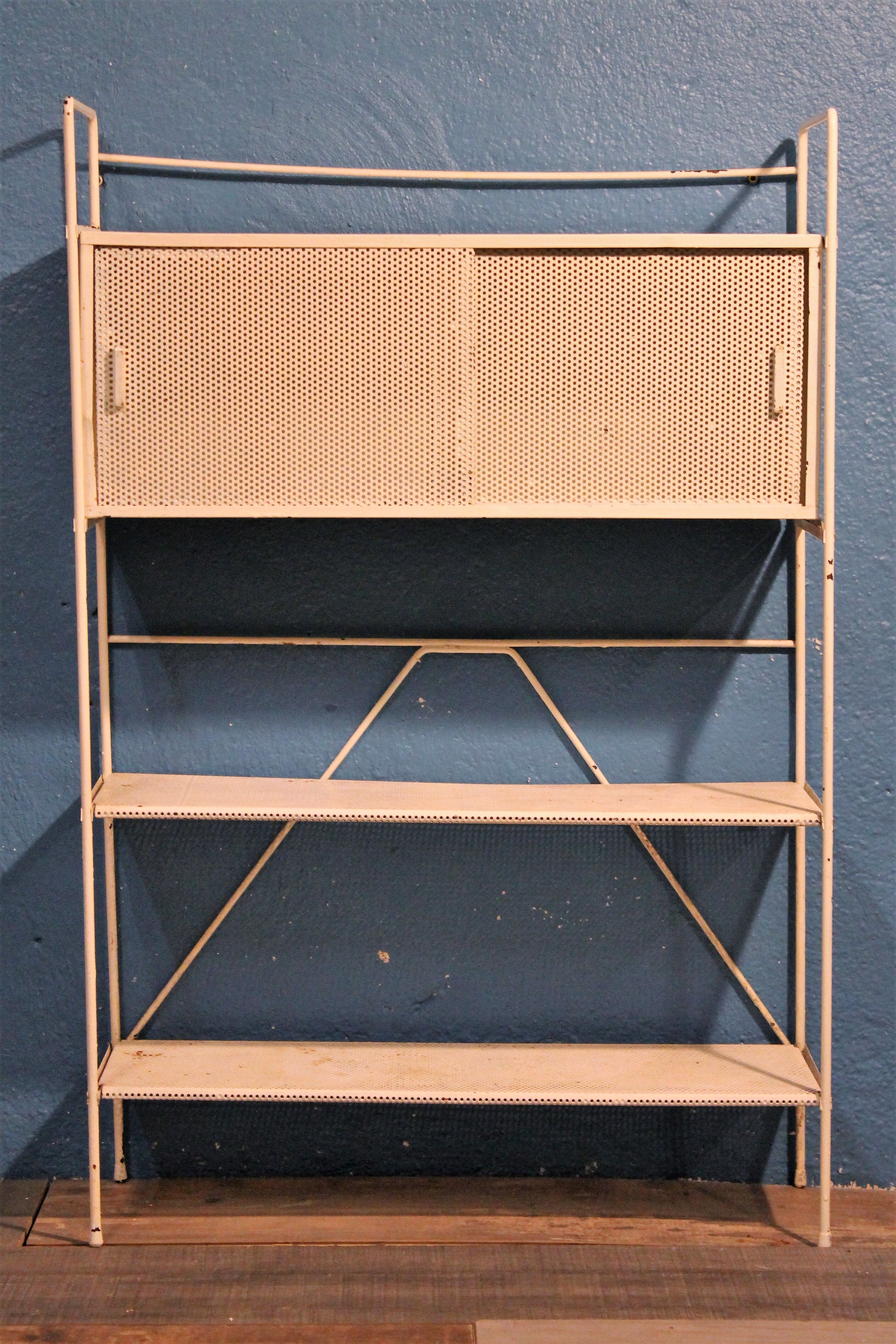 Perforated metal stand 1950