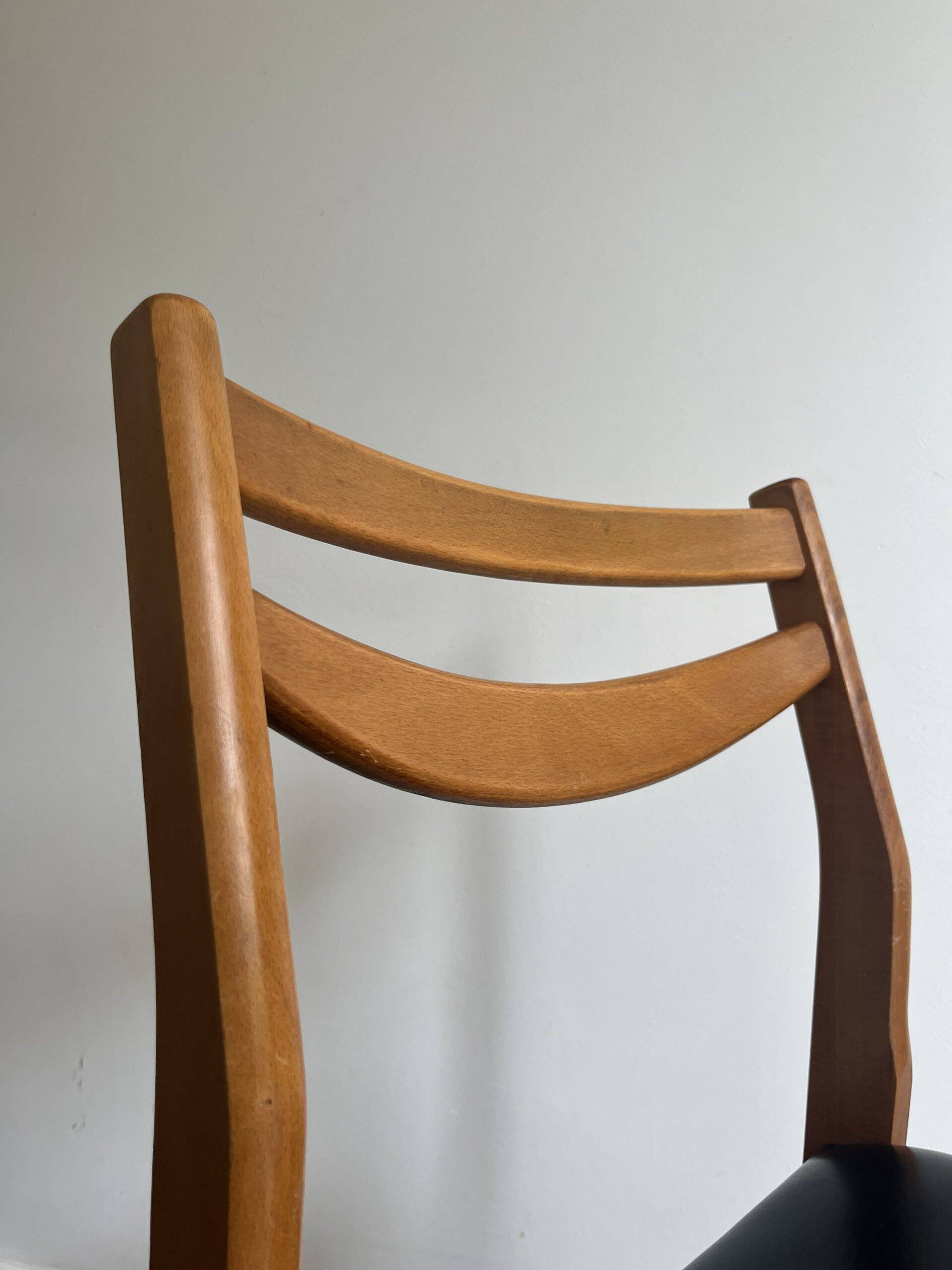 Vintage chair in wood and black leatherette