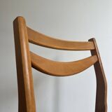 Vintage chair in wood and black leatherette