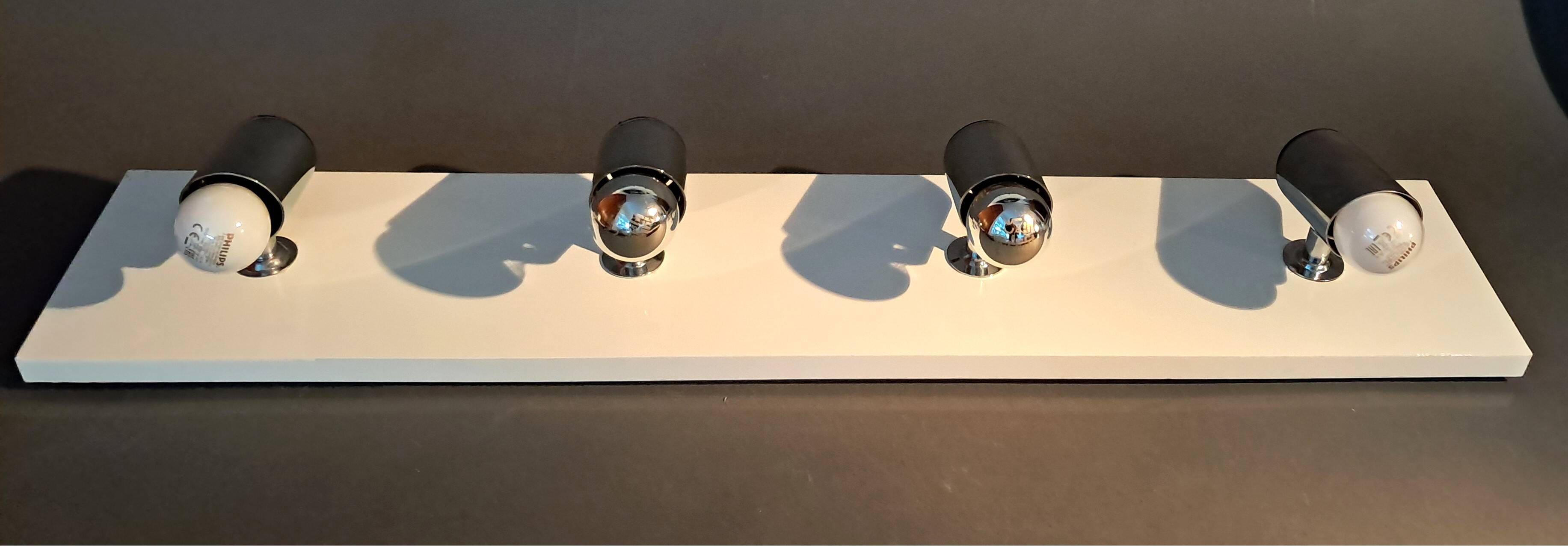 Targetti Sankey spotlights on white lacquered wooden ramp