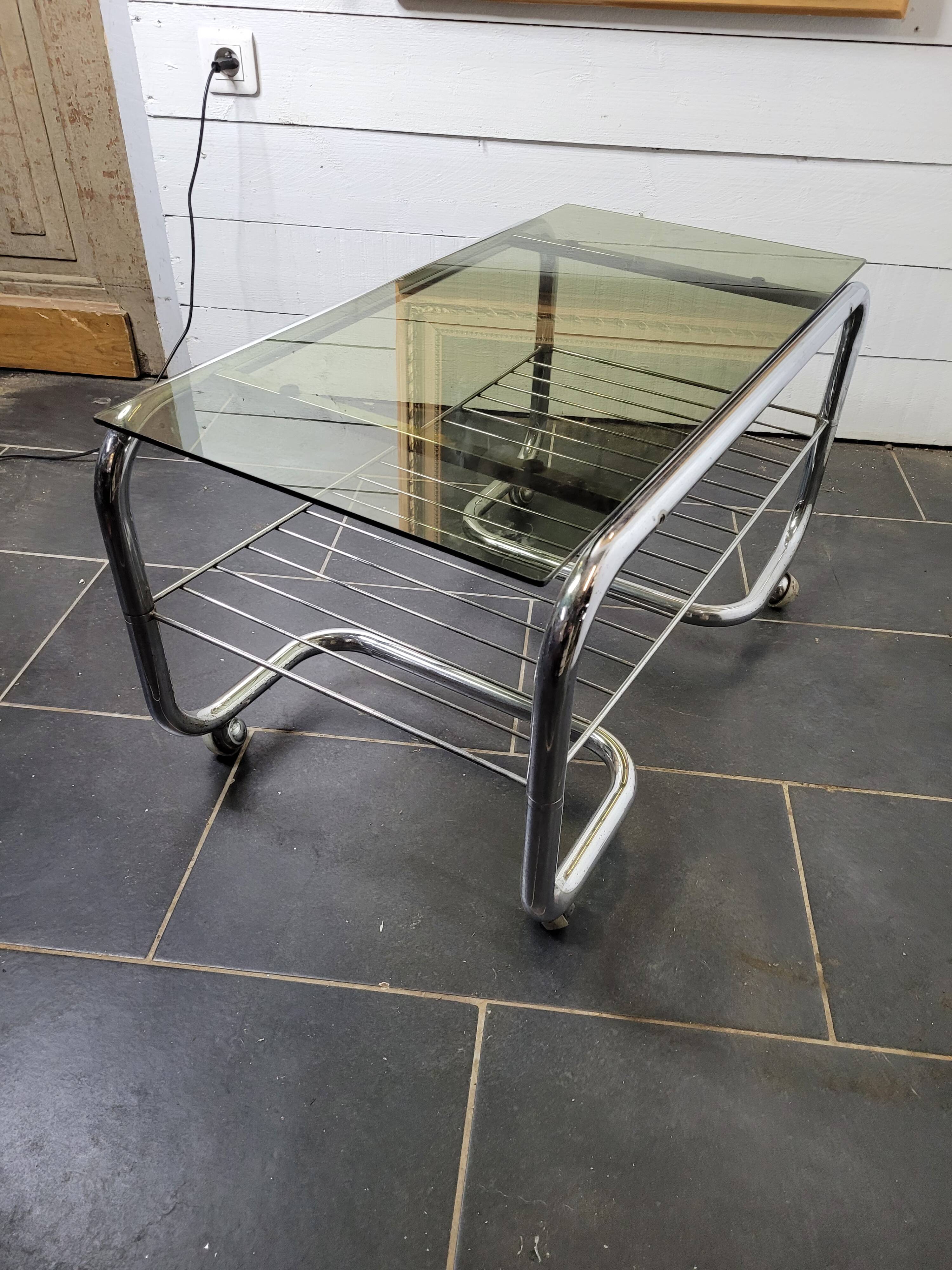 Coffee table with chrome base and smoked glass from the 70s