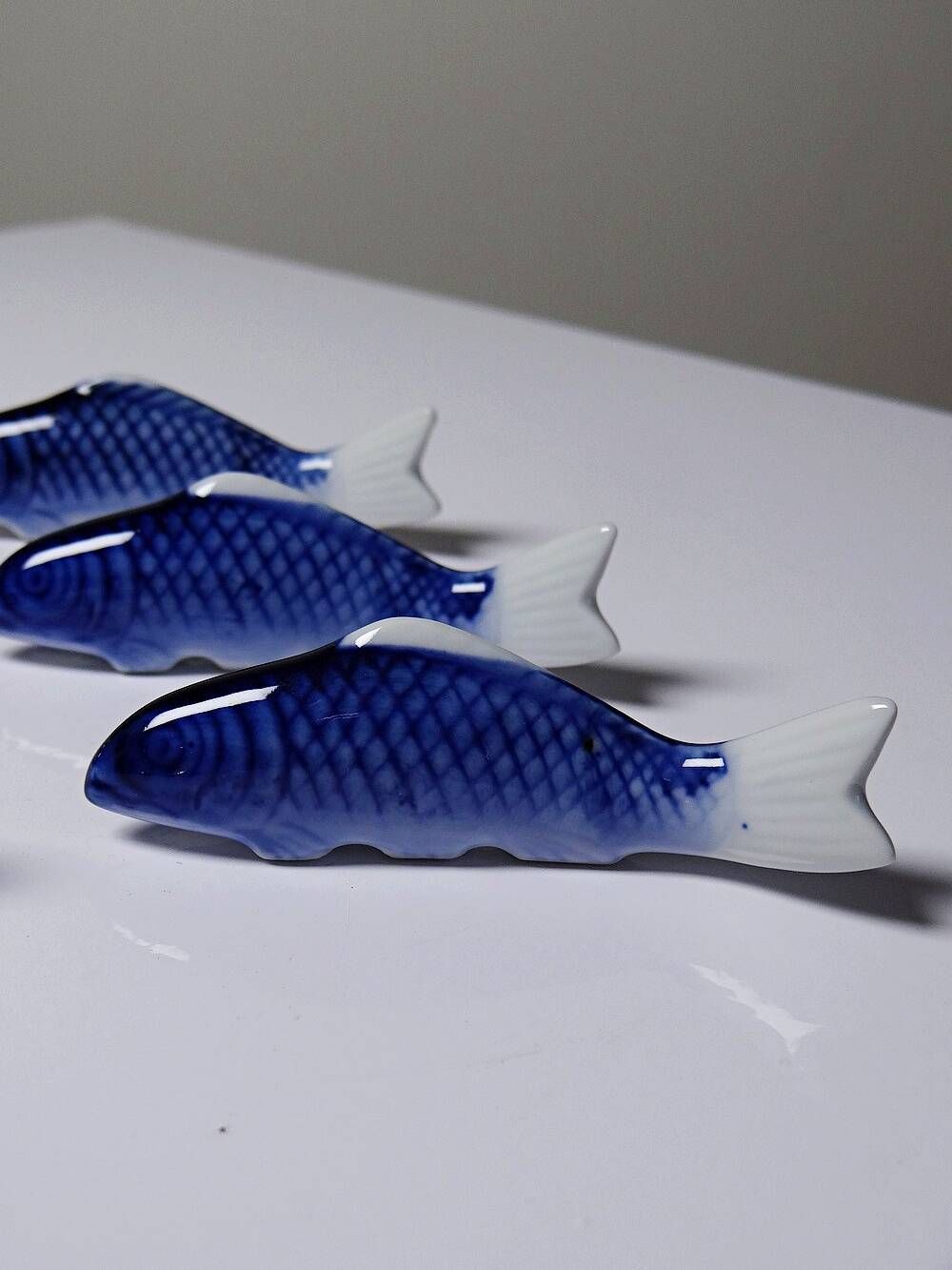 6 porcelain koi carp chopstick/knife rests, China, 1960s-1980s