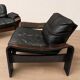 Paire de fauteuils scandinaves en cuir et palissandre