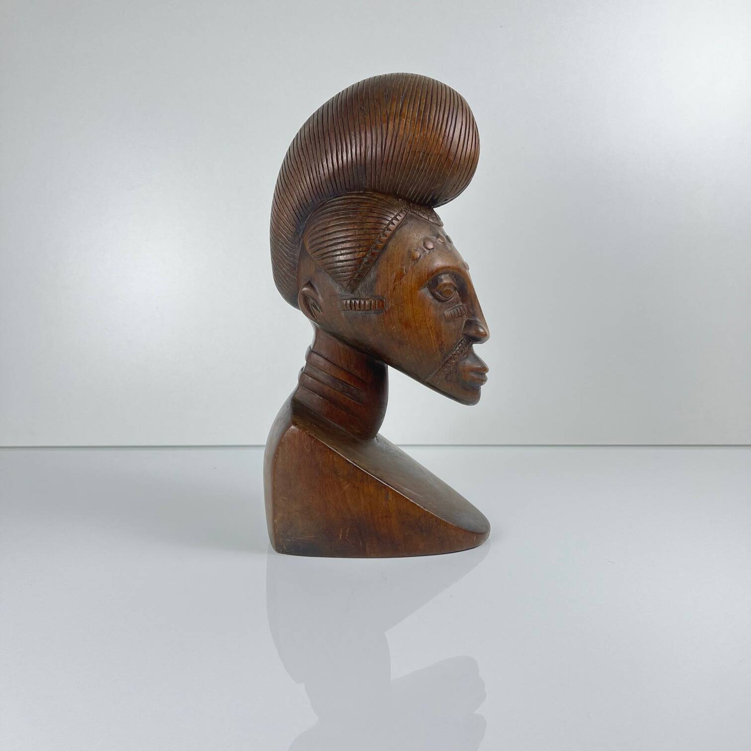 Hand-carved female bust in black wood, Baoulé style, 1960/90