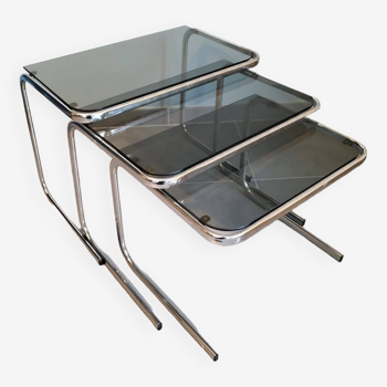 Set of 3 nesting tables with chrome metal legs and smoked glass from the 70s