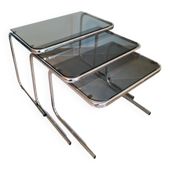 Set of 3 nesting tables with chrome metal legs and smoked glass from the 70s