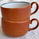 2 very and earthenware coffee cups