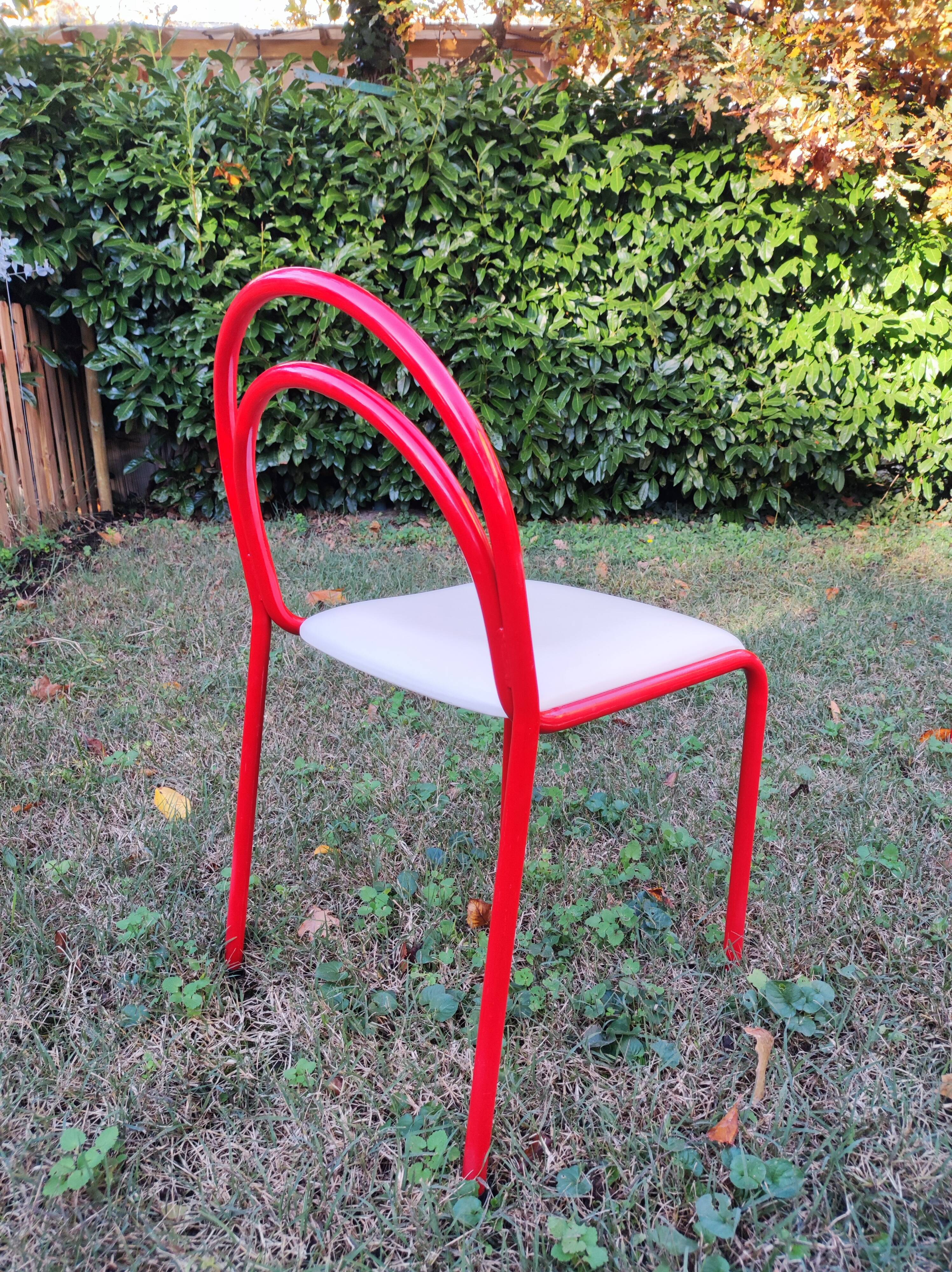 Stackable chairs, Italy, 1980s, red metal, white vinyl