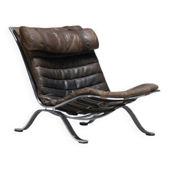 Stunning patinated ARI lounge chair in brown leather by Arne Norell - Möbel AB