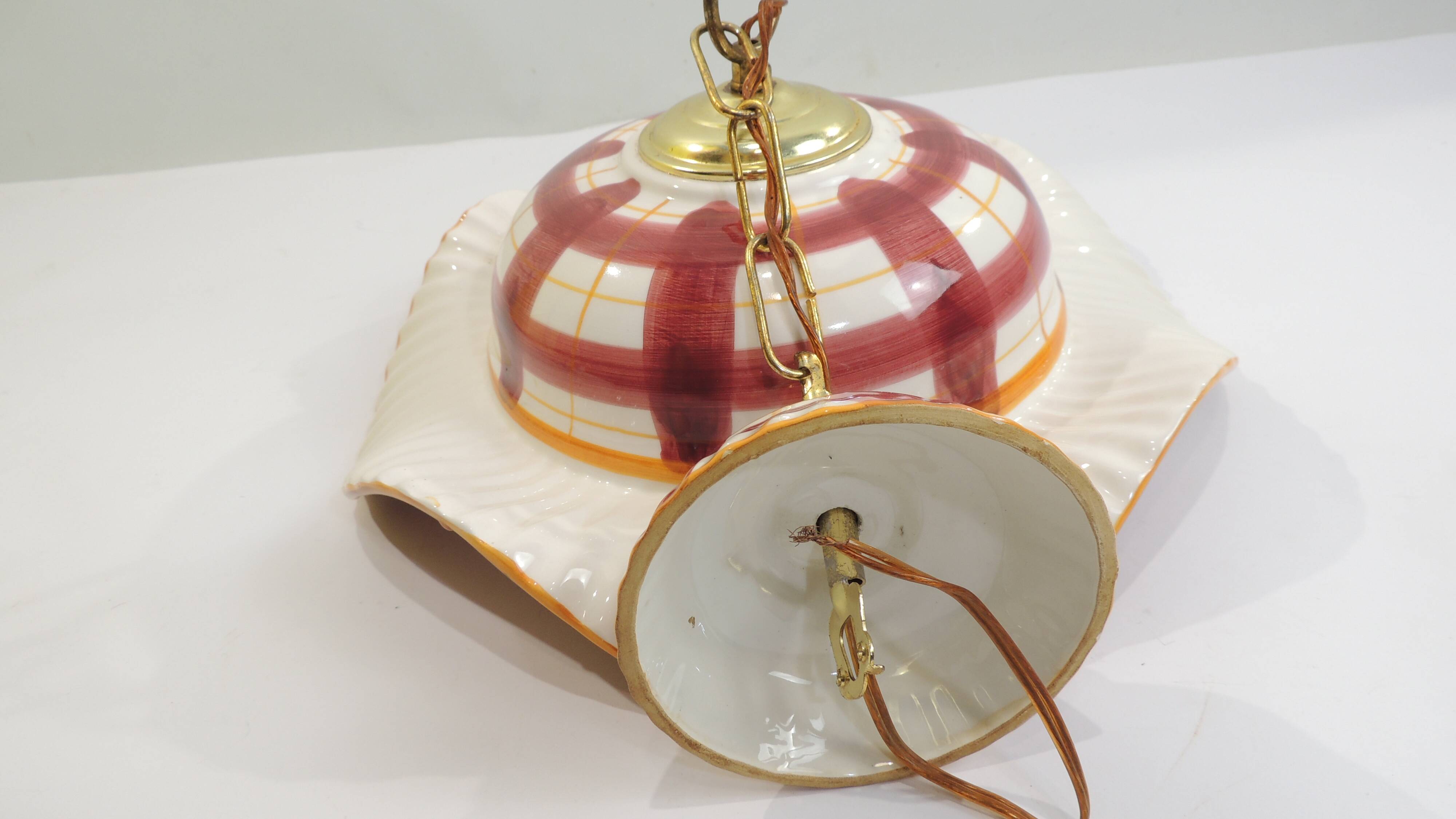 Vintage earthenware pendant light with a burgundy and ochre tartan pattern