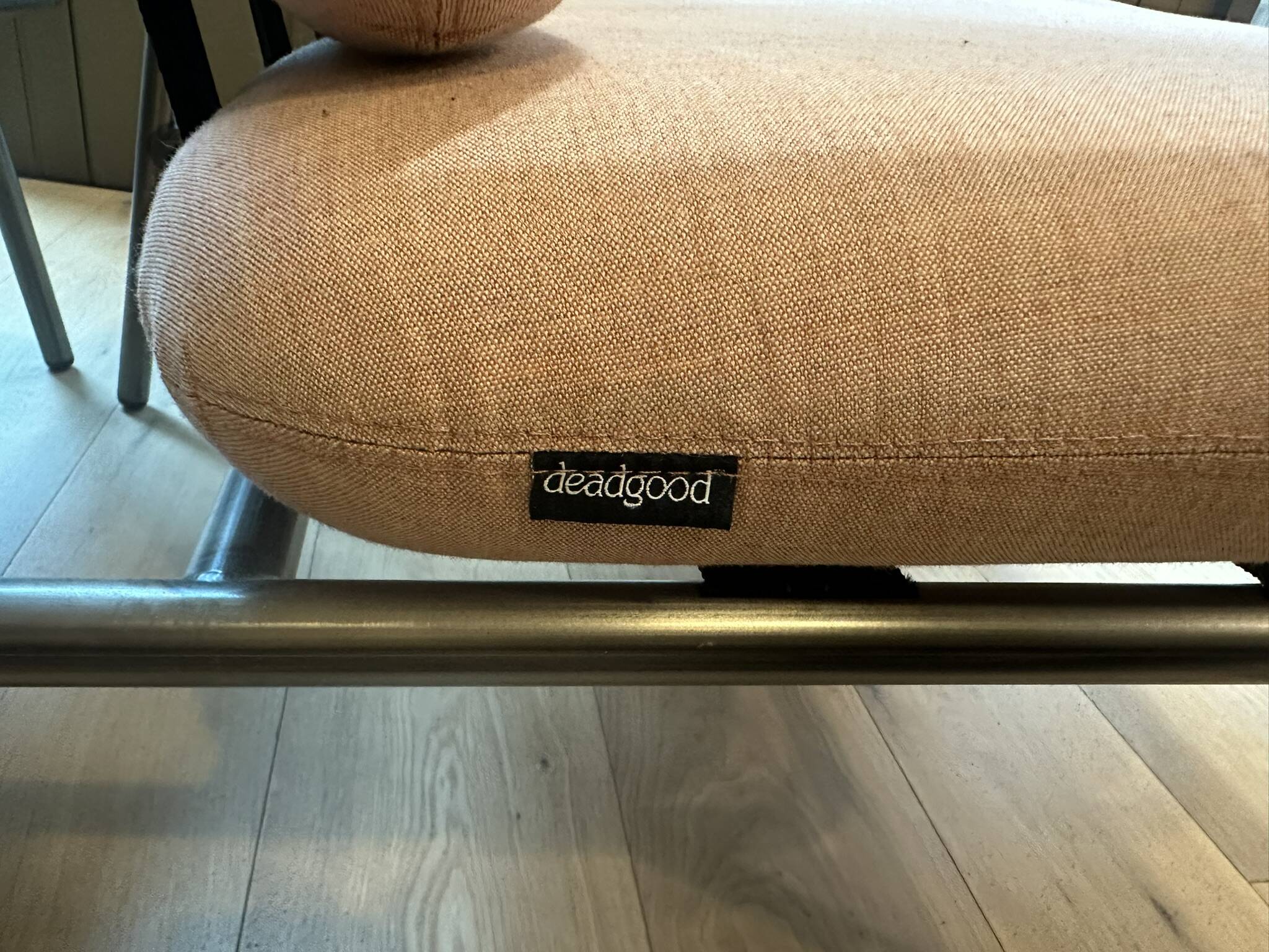 Deadgood Working Lounge Chair, in pale pink fabric with metal base