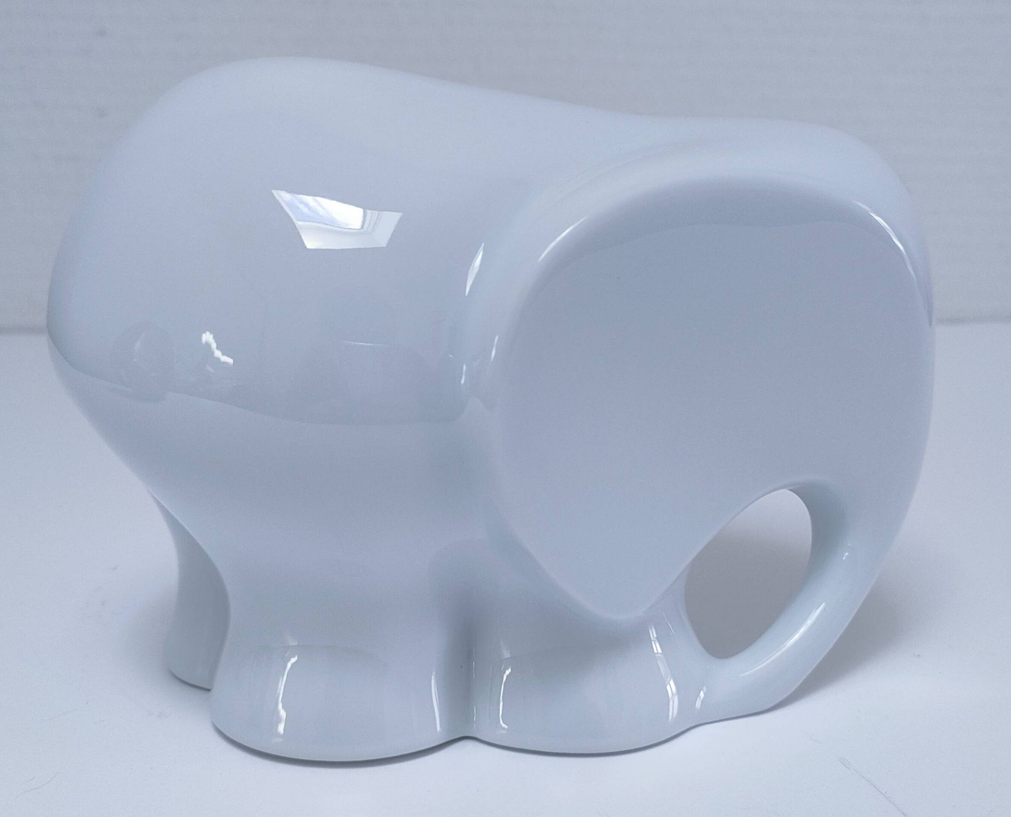 Two iridescent black and white ceramic elephants design