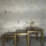 Trio of nesting tables, brass structures and smoked mirror tops