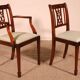 set of 10 chairs and two mahogany armchairs in Hepplewhite style