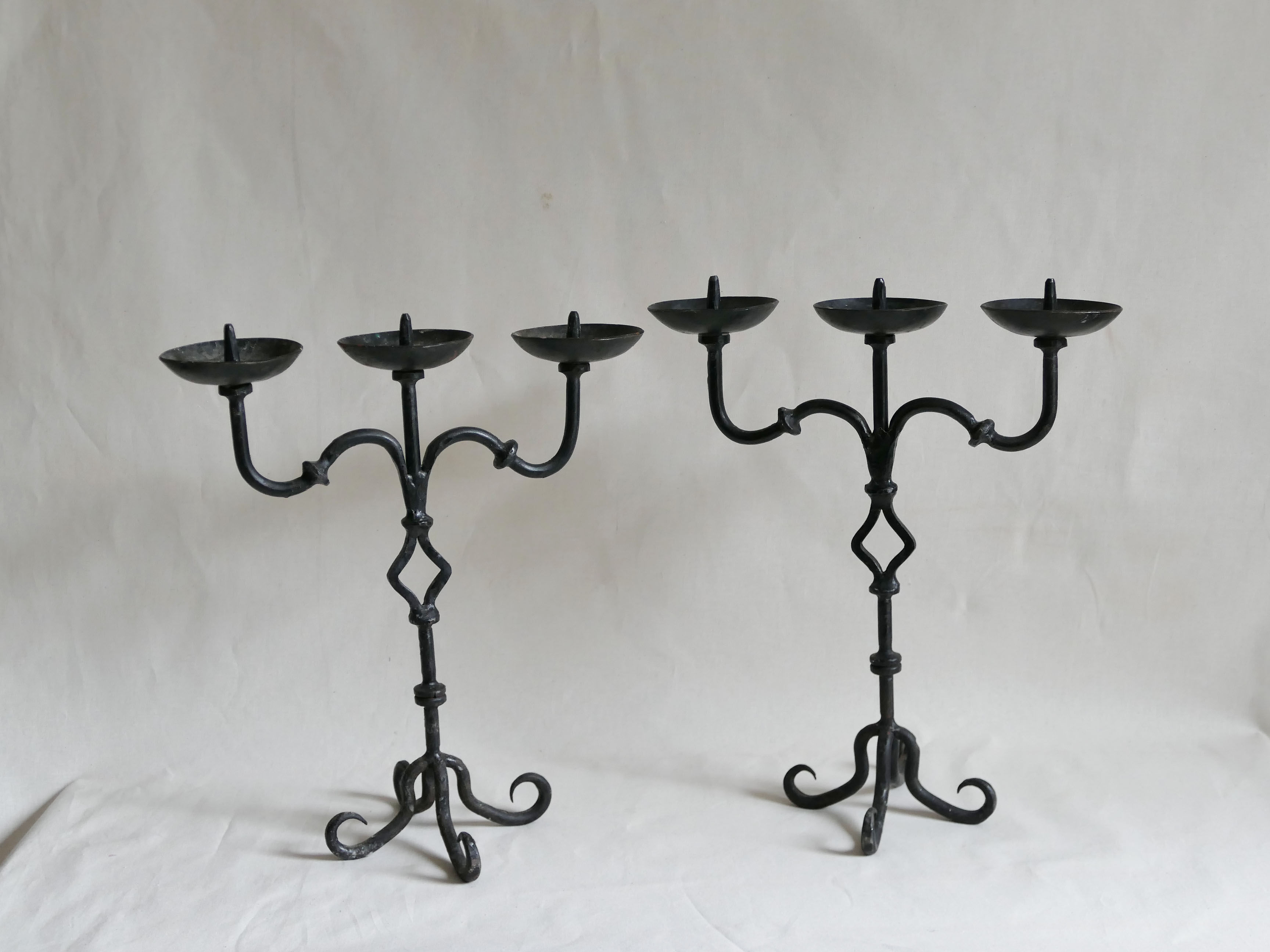 Pair of antique wrought iron chandeliers
