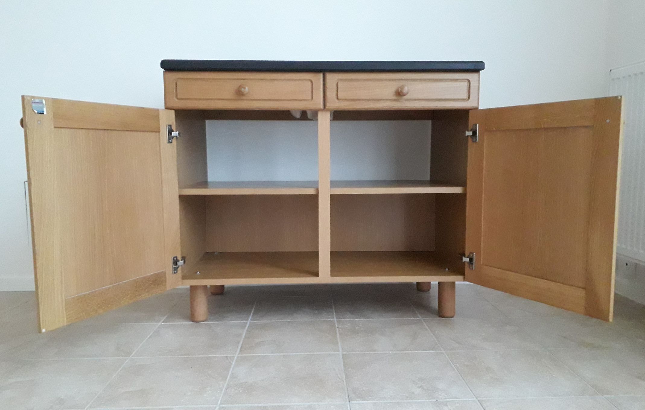 Vintage sink, black granite, oak furniture.