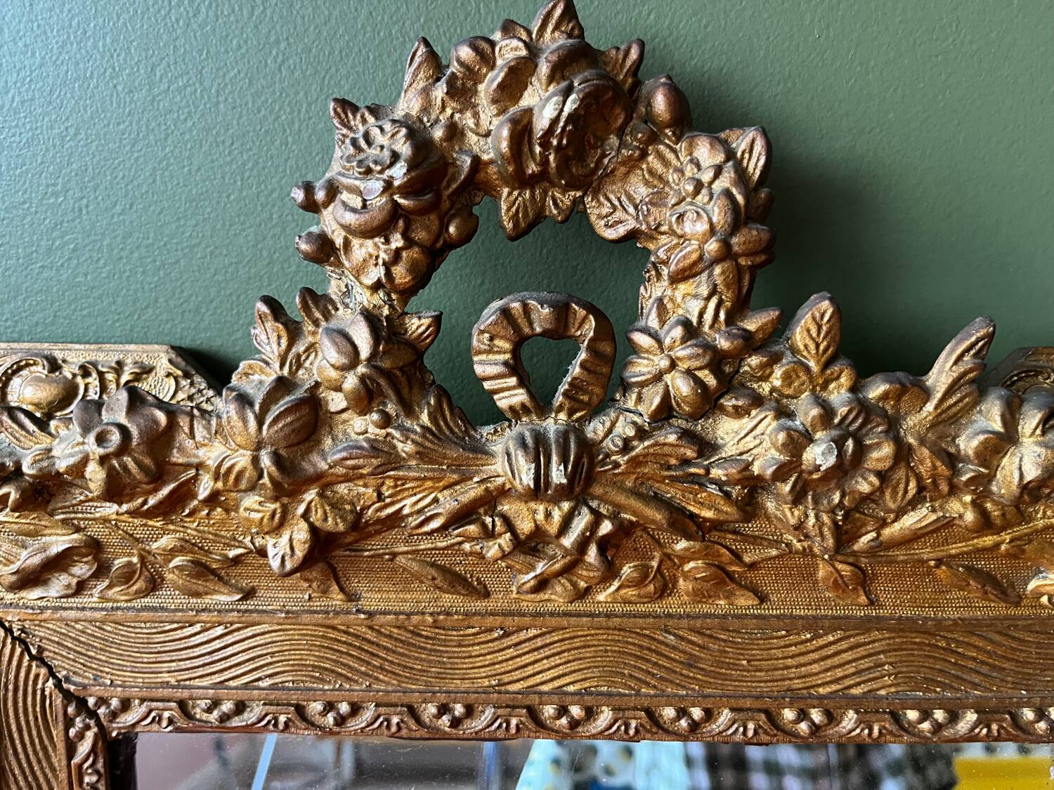 Golden trumeau mirror for fireplace, late 19th century, with sculpted pediment.