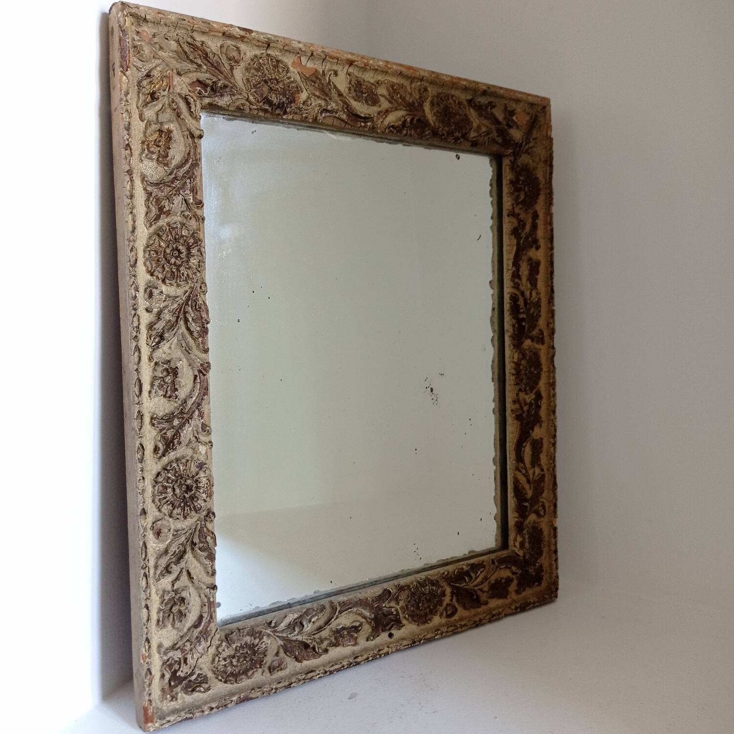 Wood and patinated stucco mirror