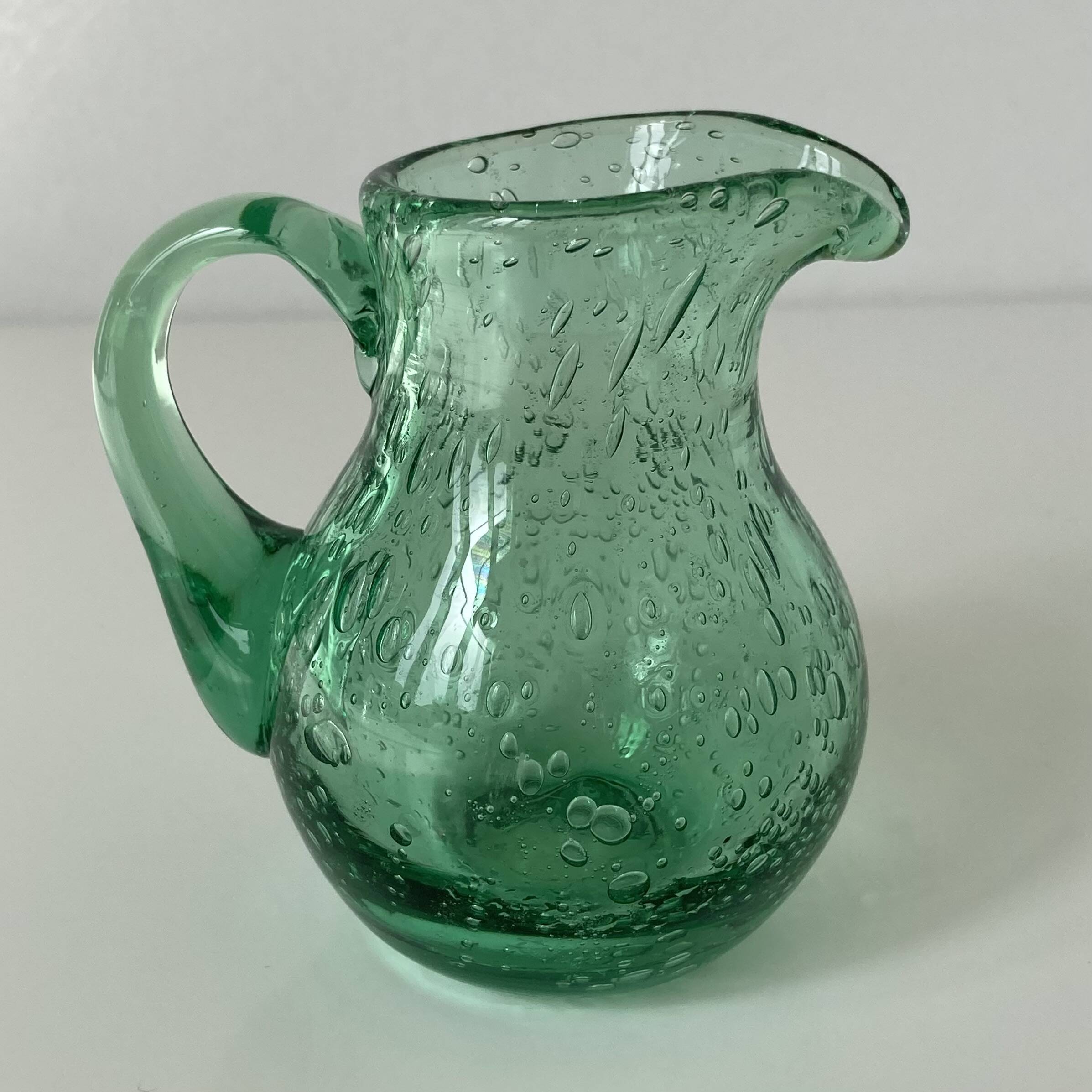 Miniature glass jug or pitcher with bubble effect, mint water, signed Biot.