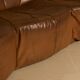 "Pumpkin" 3-seater canapé in patinated brown leather by Pierre Paulin for Arti.